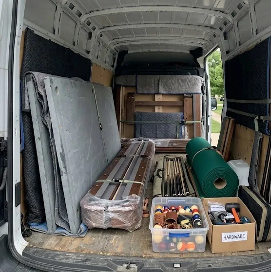 Pool table parts loaded inside a cargo van